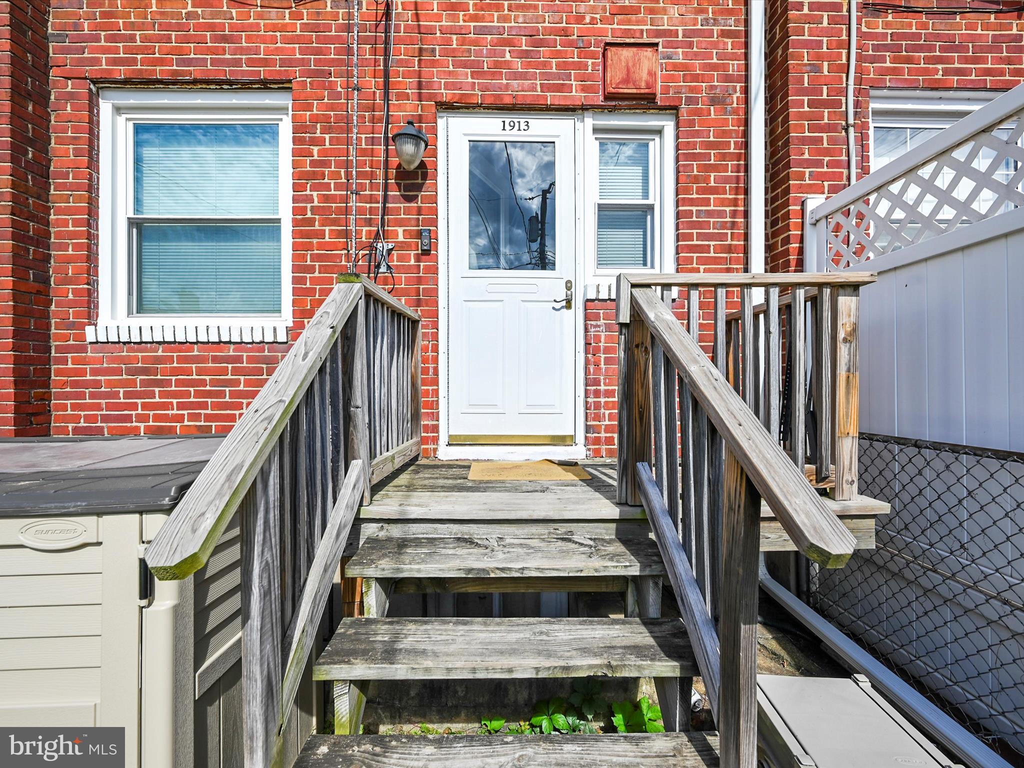 1913 Nevill Road Baltimore, MD 21222 - Photo 33 of 37 a view of staircase with wooden floor and white walls