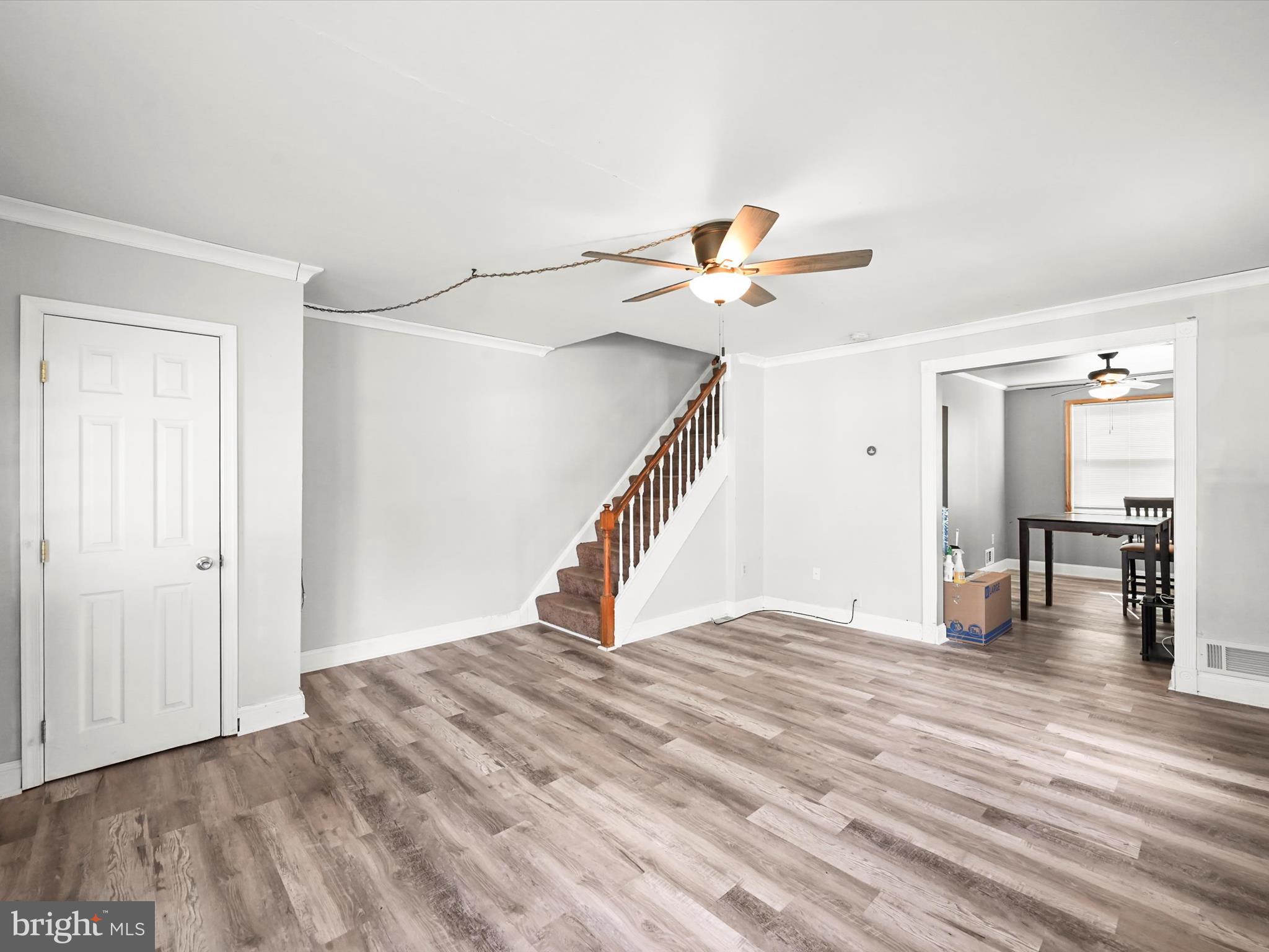 1913 Nevill Road Baltimore, MD 21222 - Photo 7 of 37 a view of a livingroom with wooden floor and a ceiling fan