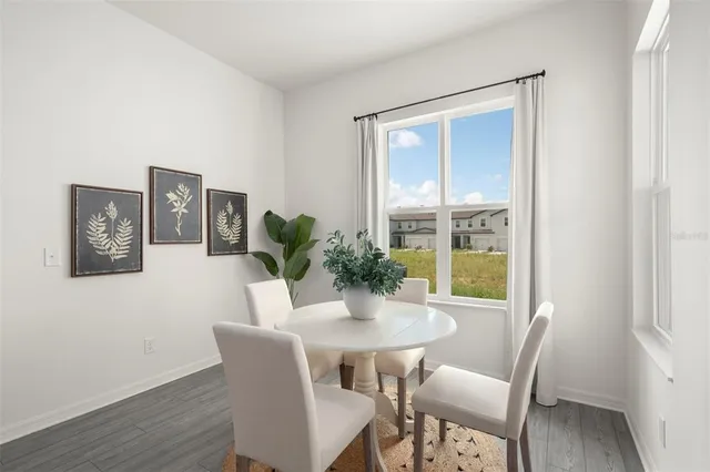 a dining room with furniture and window
