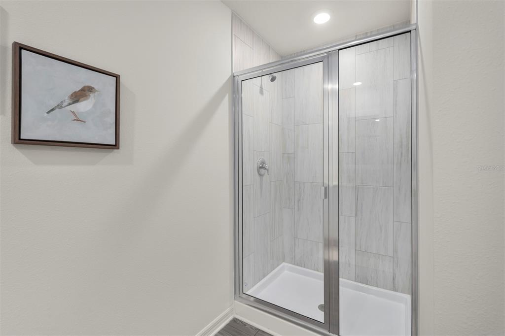 727 Poppy Lane Dundee, FL 33838 - Photo 18 of 31 a bathroom with a shower