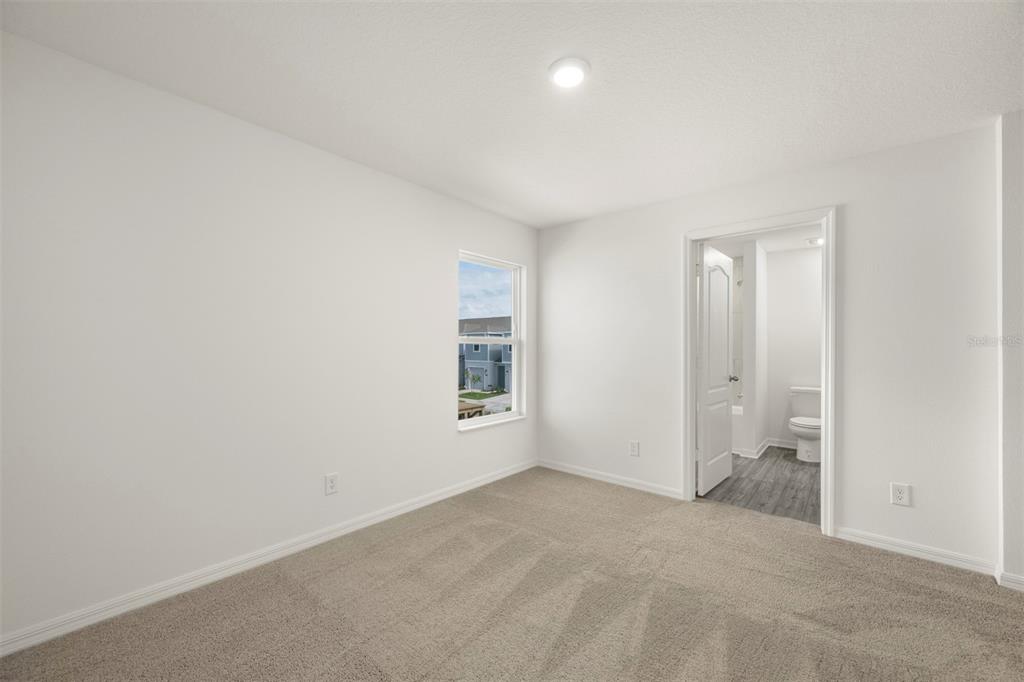727 Poppy Lane Dundee, FL 33838 - Photo 19 of 31 an empty room with a empty space and windows