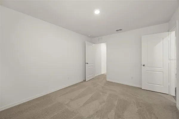 an empty room with a empty space and windows