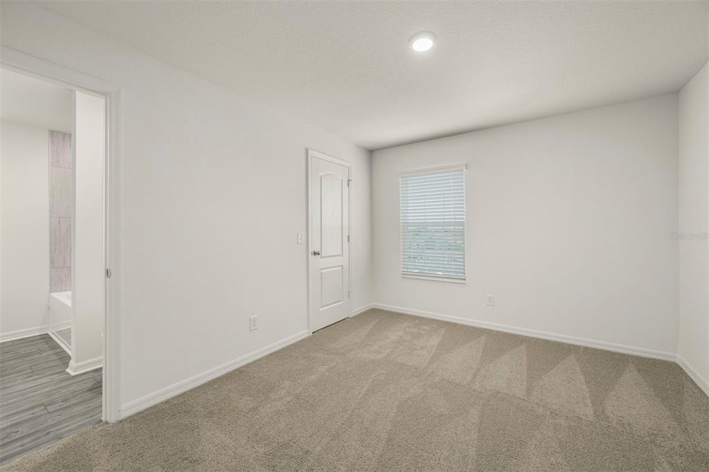 727 Poppy Lane Dundee, FL 33838 - Photo 24 of 31 an empty room with a empty space and windows