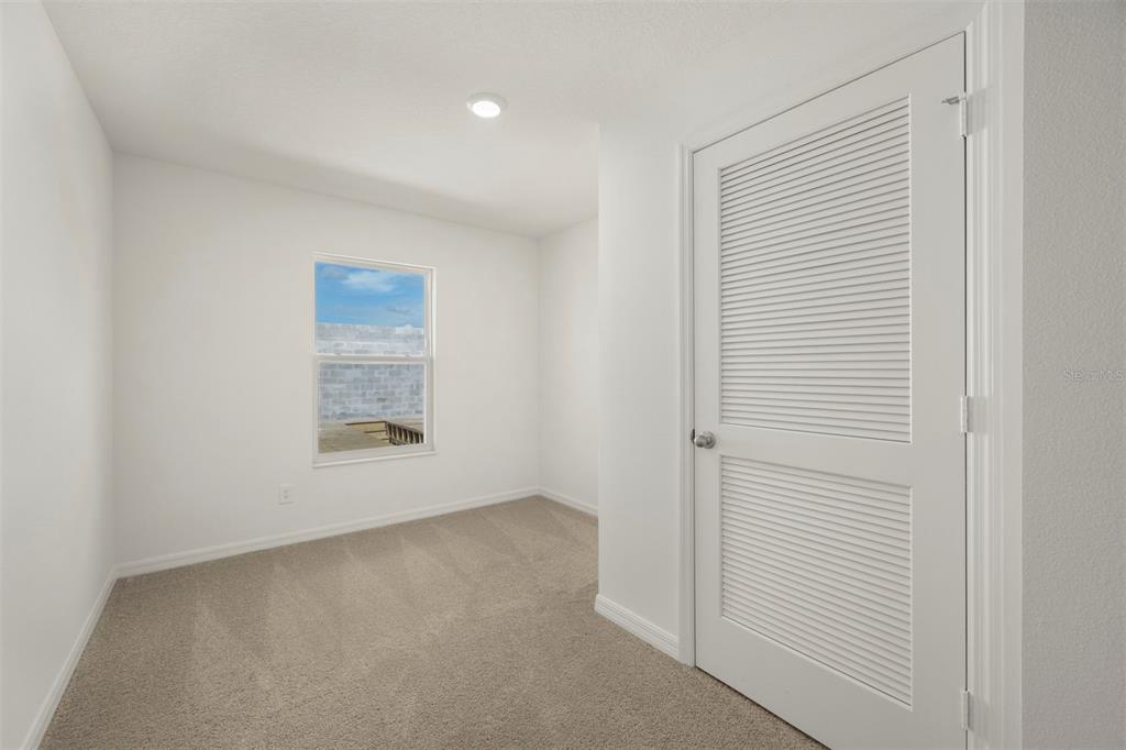 727 Poppy Lane Dundee, FL 33838 - Photo 26 of 31 a view of an empty room with a window