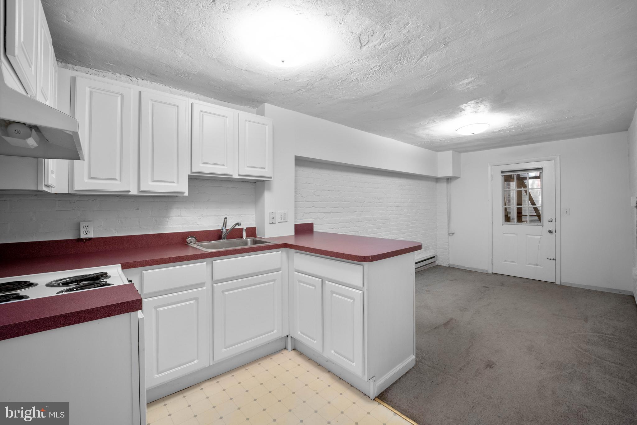2220 Tunlaw Road Northwest Washington, DC 20007 - Photo 35 of 50 Lower Level Kitchenette & Living Area