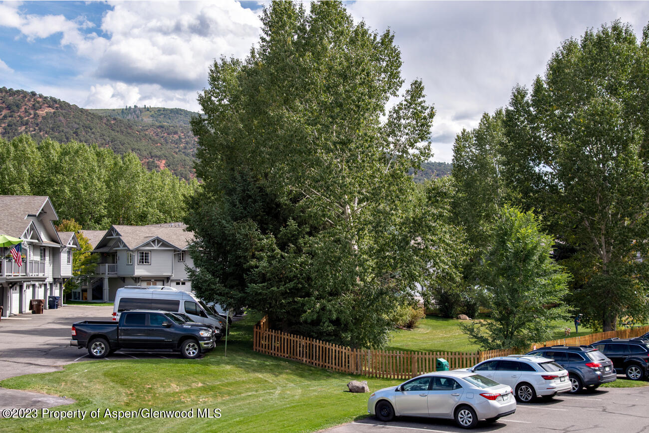 2208 Elk Lane Basalt, CO 81621 - Photo 13 of 20 a front view of a house with a garden and car parked