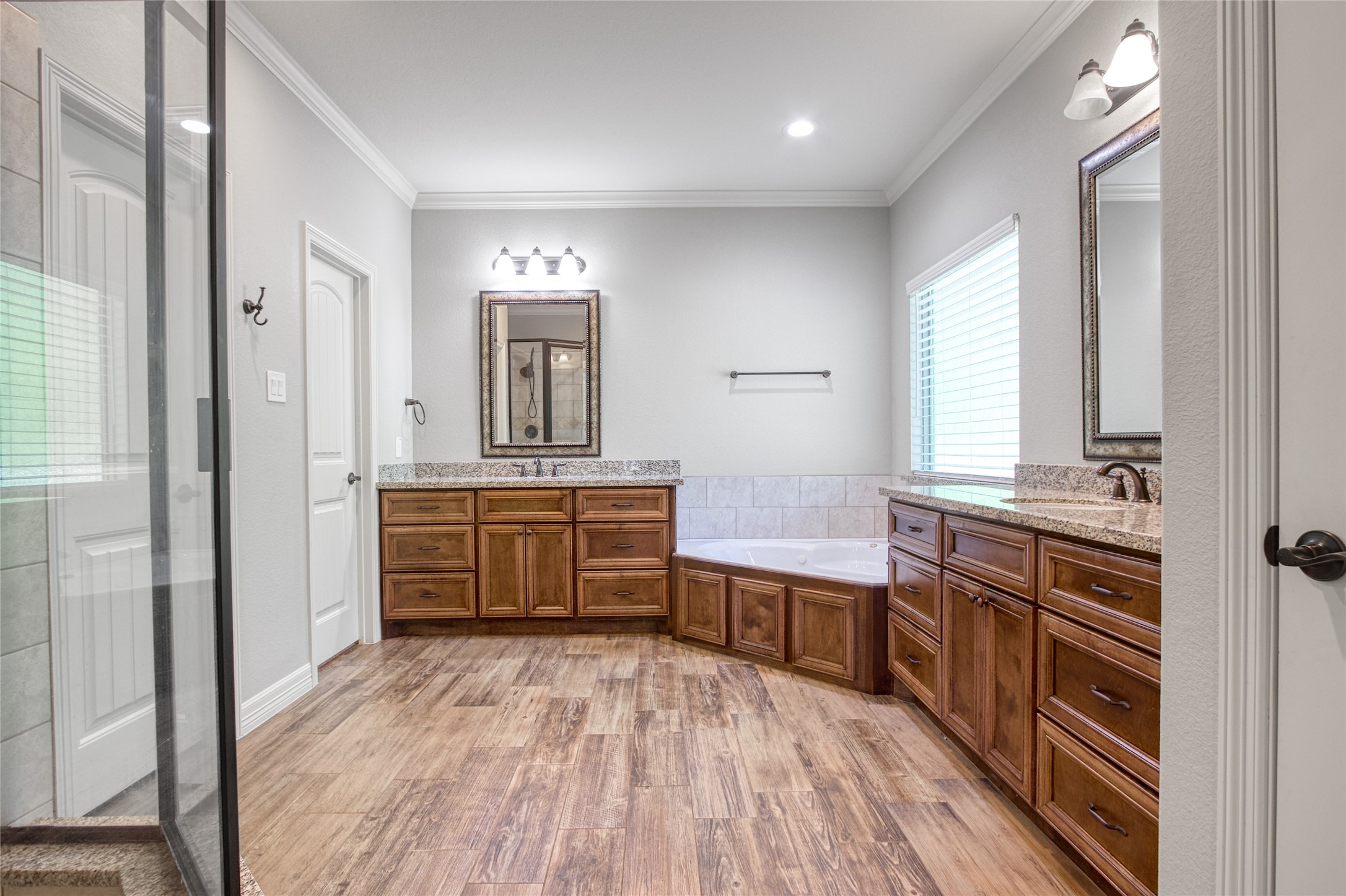 27684 Rio Blanco Drive Splendora, TX 77372 - Photo 14 of 31 a kitchen with stainless steel appliances a sink cabinets and wooden floor