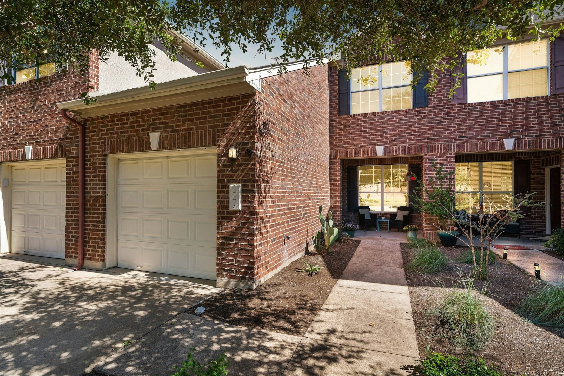 a view of house with patio outdoor seating