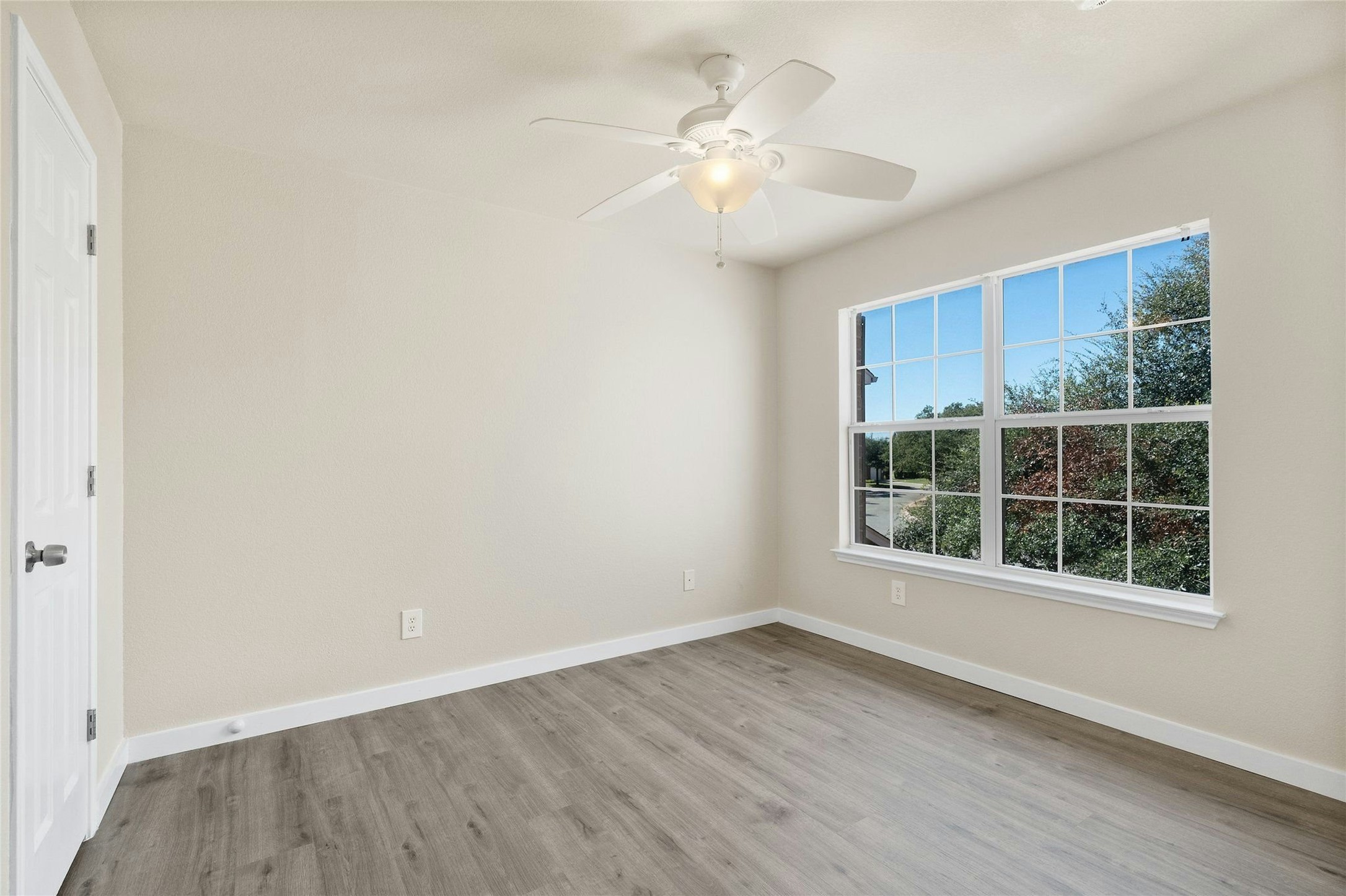 44 Verde Ranch Loop Leander, TX 78641 - Photo 15 of 24 an empty room with wooden floor and windows