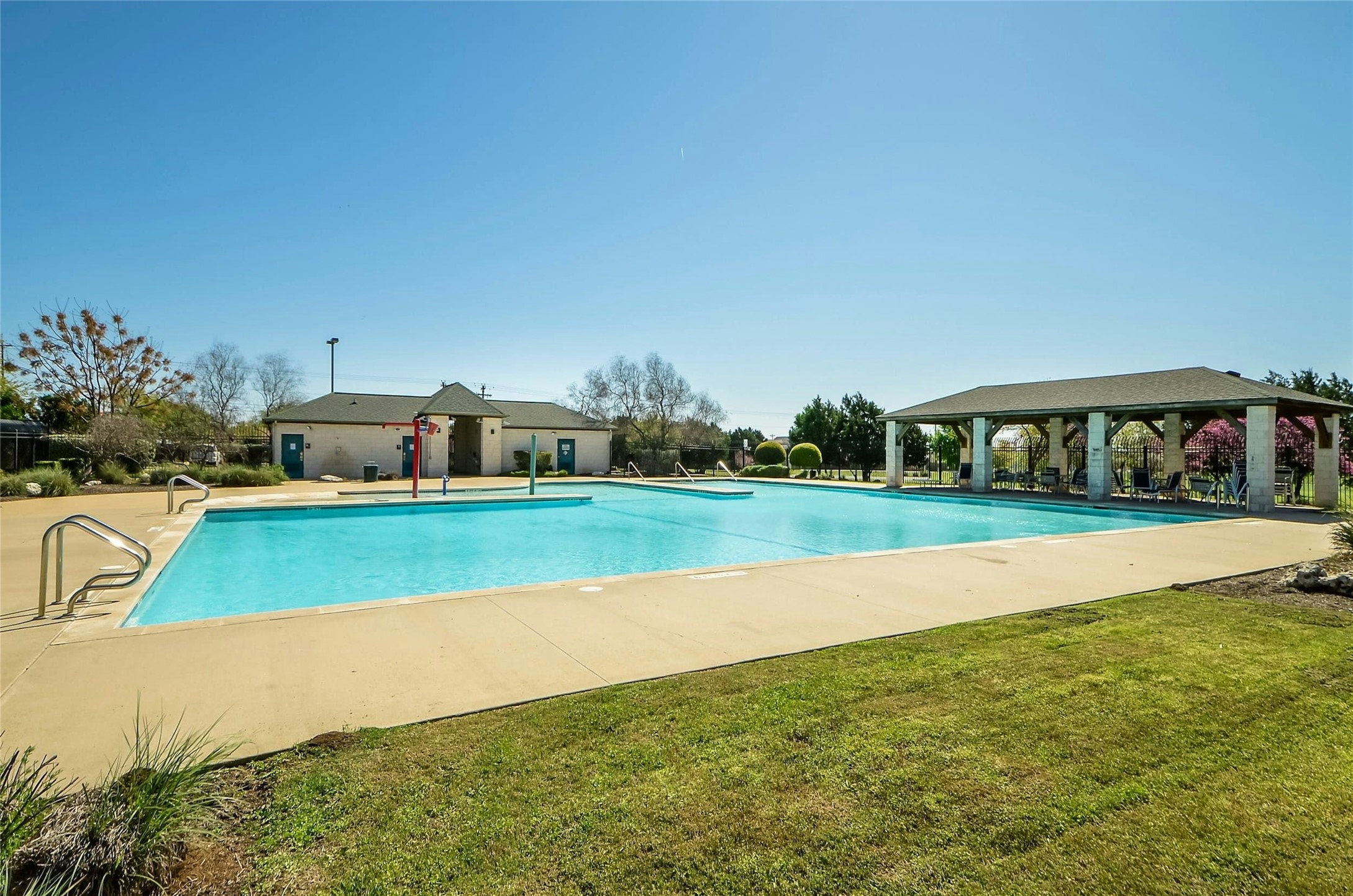 44 Verde Ranch Loop Leander, TX 78641 - Photo 21 of 24 a view of yard with swimming pool and green space