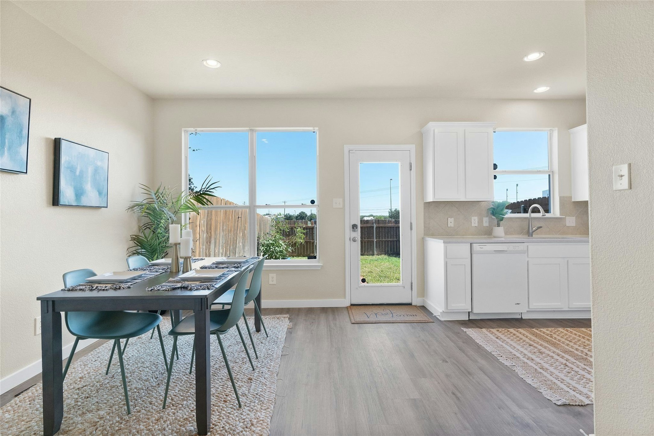 44 Verde Ranch Loop Leander, TX 78641 - Photo 6 of 24 a kitchen with a table and chairs in it