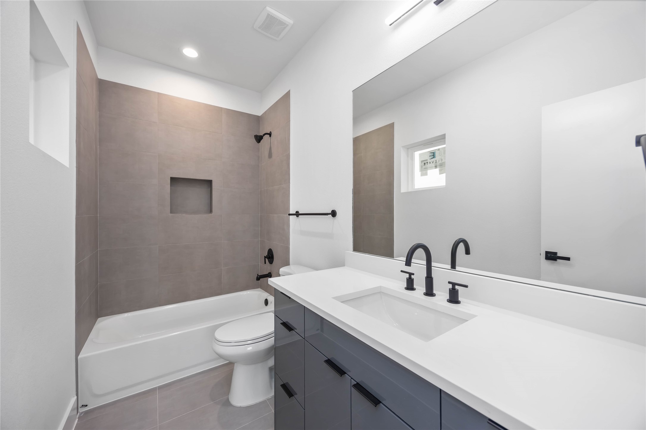 6735 Peerless Street, Unit C Houston, TX 77021 - Photo 12 of 27 a bathroom with a sink a toilet and a mirror