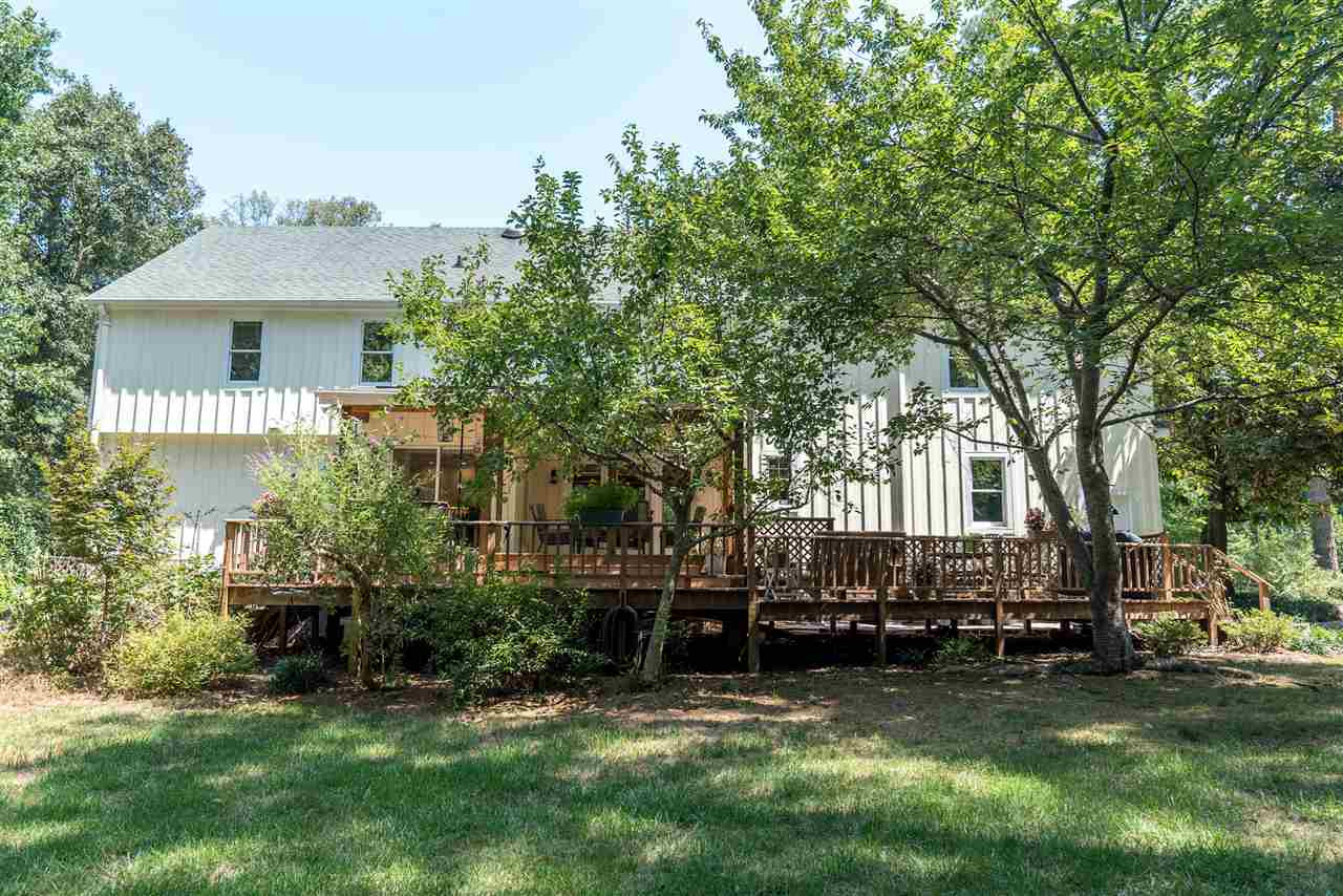 9301 Foxburrow Court Raleigh, NC 27613 - Photo 24 of 25 Surrounded by cherry blossom tree's, this backyard is extremely private and has both natural space and grass for whatever use your family may have! Rear Elevation