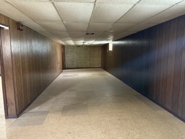 a view of hallway with an empty room