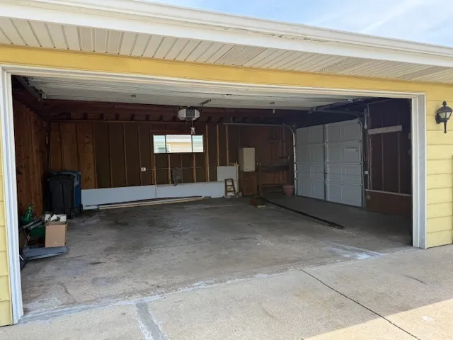 a view of a hallway with wooden shelves
