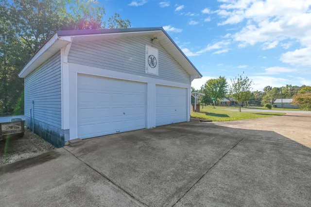 a view of a swimming pool with an outdoor seating and a yard