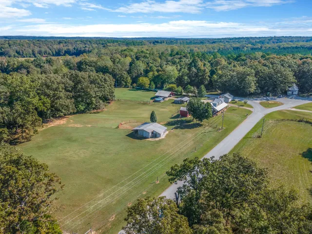 a view of a swimming pool with a yard