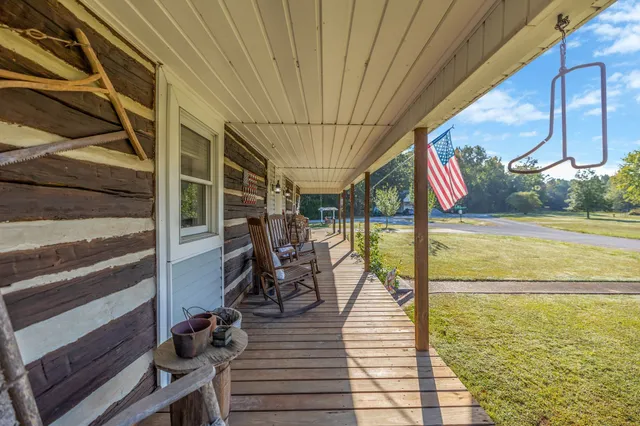 a view of swimming pool with seating area