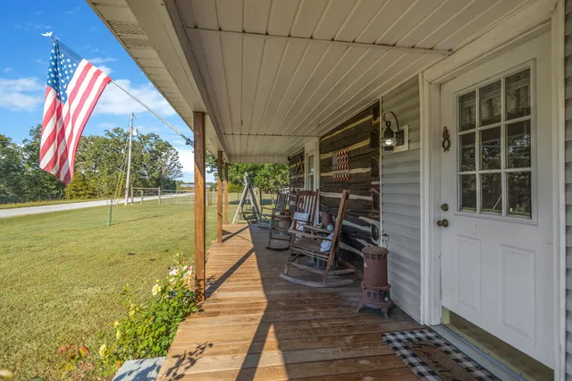 a swimming pool with outdoor seating
