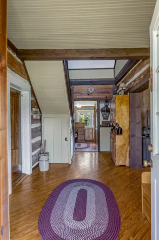 a view of an entryway with wooden floor