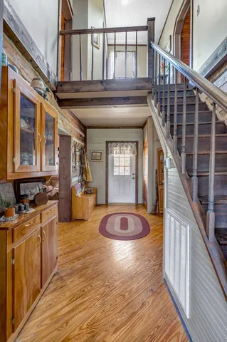 a view of a room with wooden floor