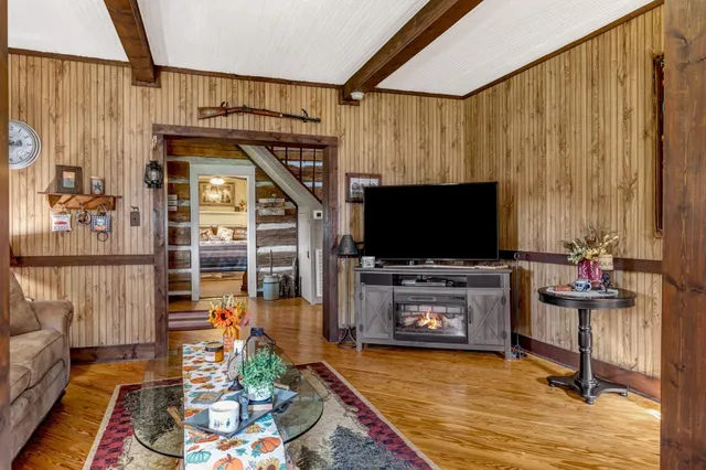 a living room with furniture and a flat screen tv