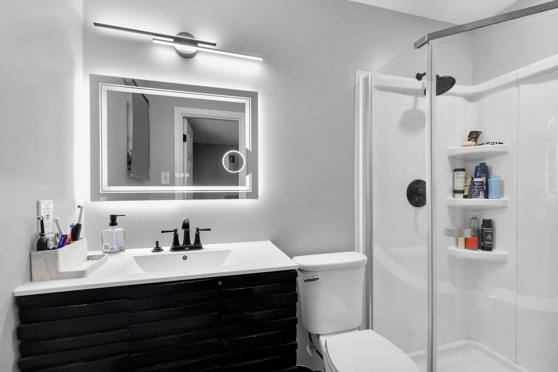 34 Key Haven Road Key Haven, FL 33040 - Photo 24 of 34 a bathroom with a sink vanity mirror and toilet