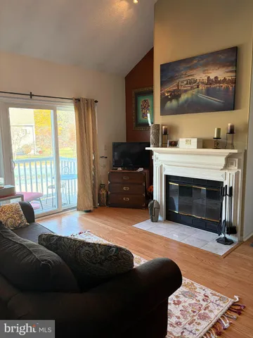 a bedroom with a bed and a fireplace