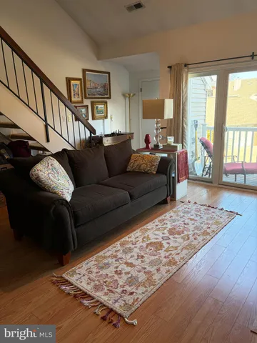 a living room with furniture and a rug