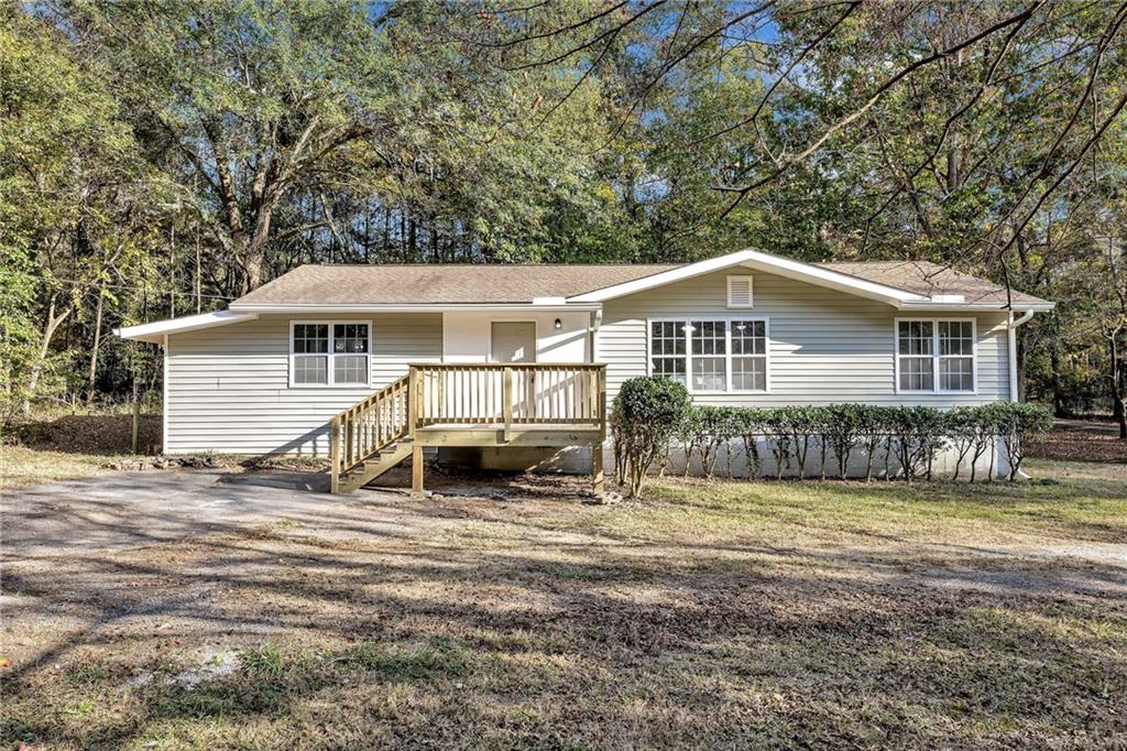 4359 Campbell Road Snellville, GA 30039 - Photo 1 of 1 Ranch-style house with a wooden deck