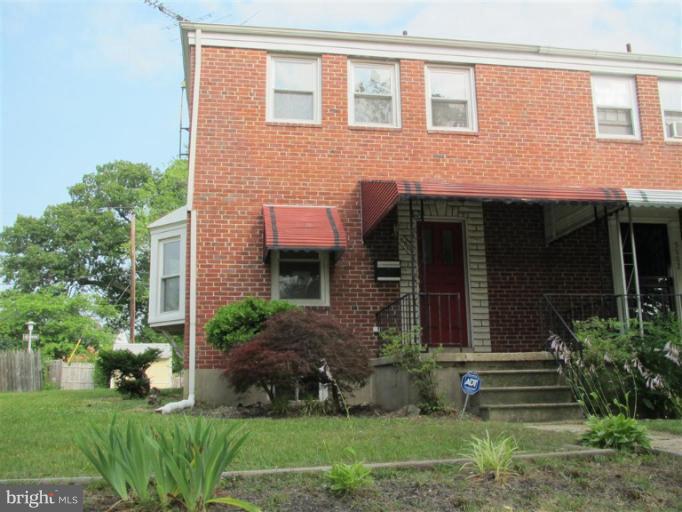 5900 Hillen Road Baltimore, MD 21239 - Photo 10 of 11 a front view of a house with a yard