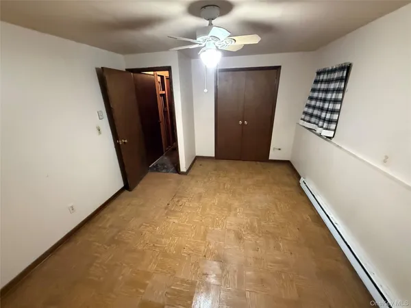 a view of an empty room with a fireplace