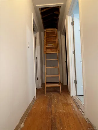 a bed sitting in a bedroom and tv
