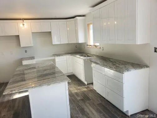 a room with cabinets and wooden floor