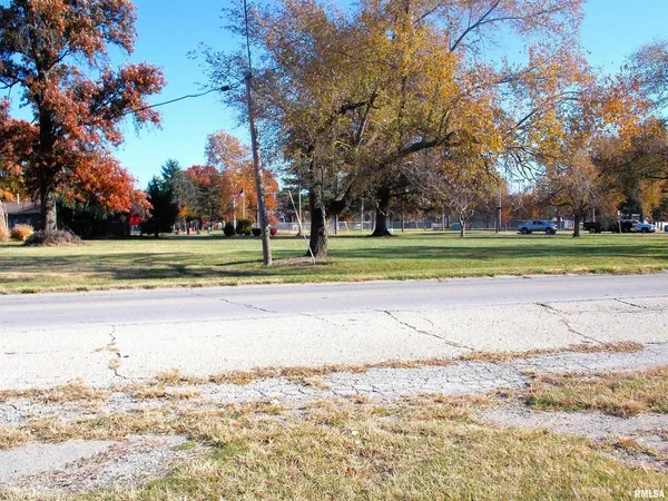 a view of a swimming pool and a yard