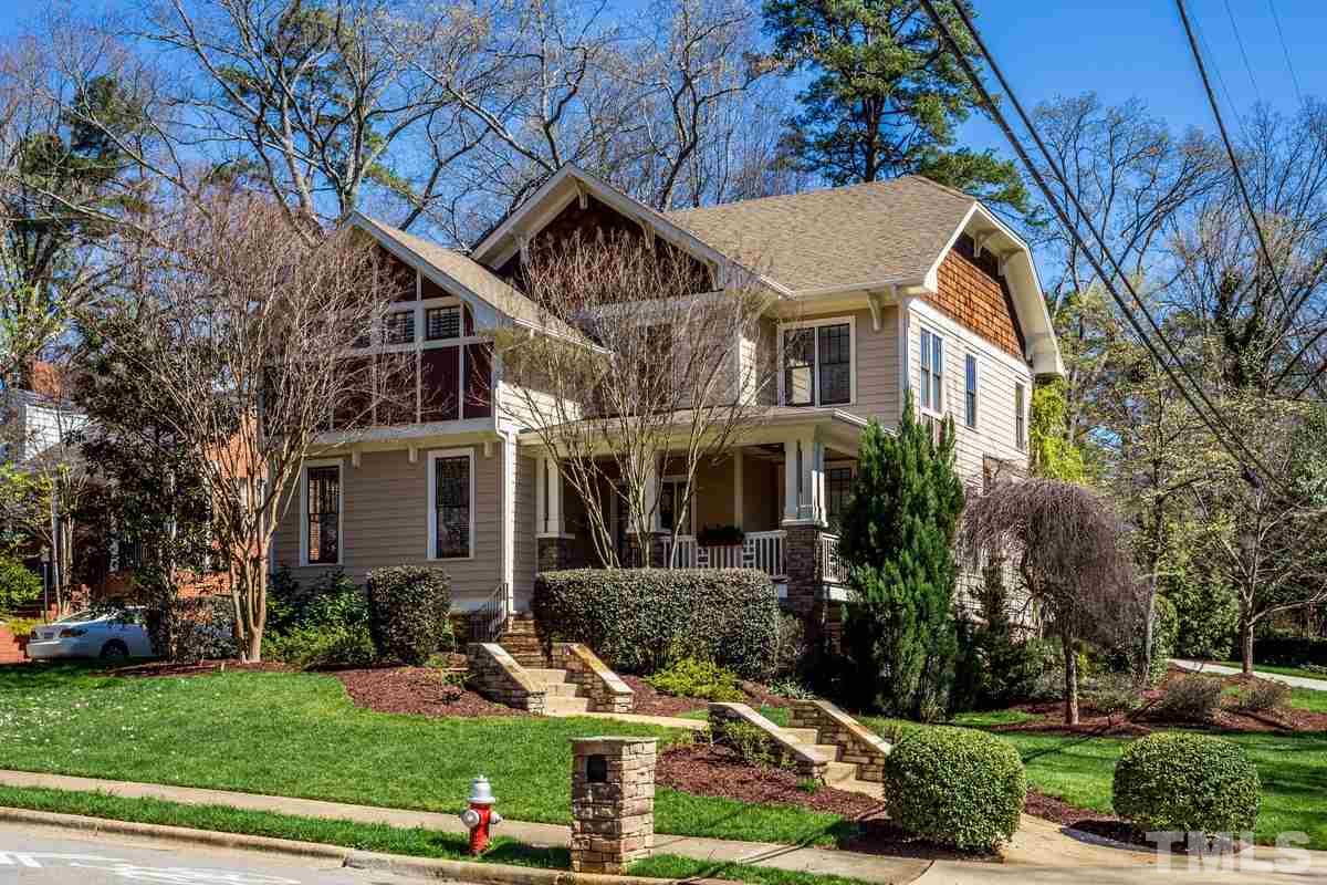 1300 Dixie Trail Raleigh, NC 27607 - Photo 1 of 24 a front view of a house with garden