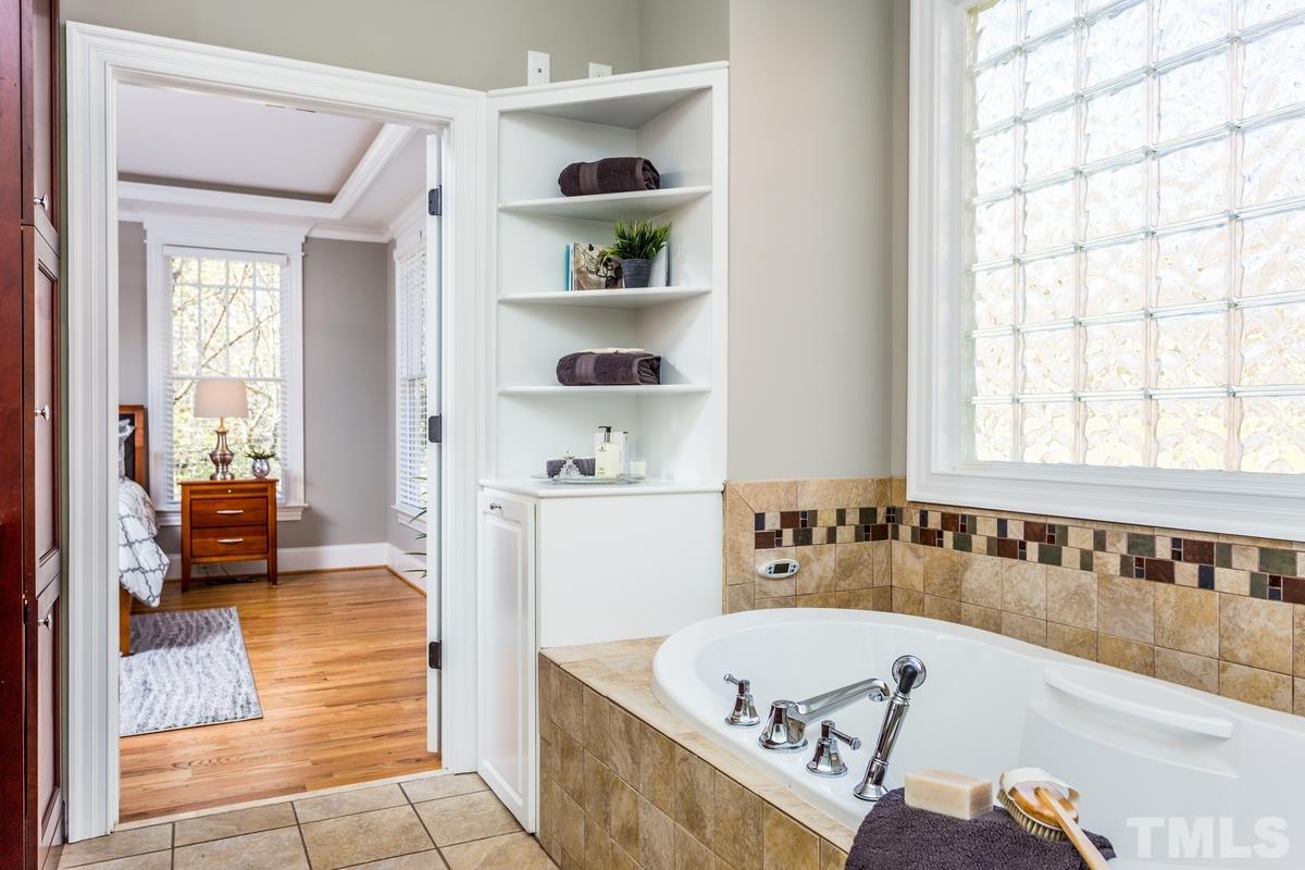 1300 Dixie Trail Raleigh, NC 27607 - Photo 13 of 24 a bathroom with a bathtub and a shower