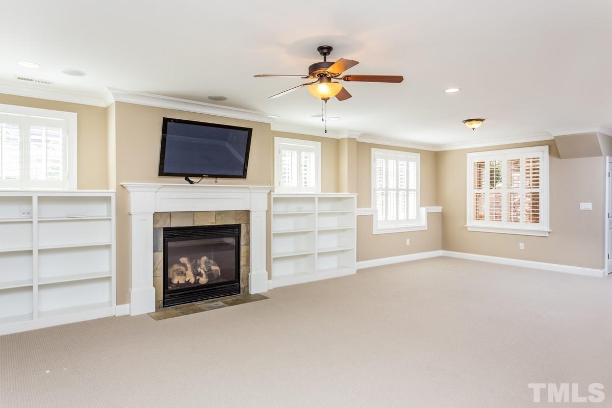 1300 Dixie Trail Raleigh, NC 27607 - Photo 20 of 24 a view of an empty room with a fireplace and a window