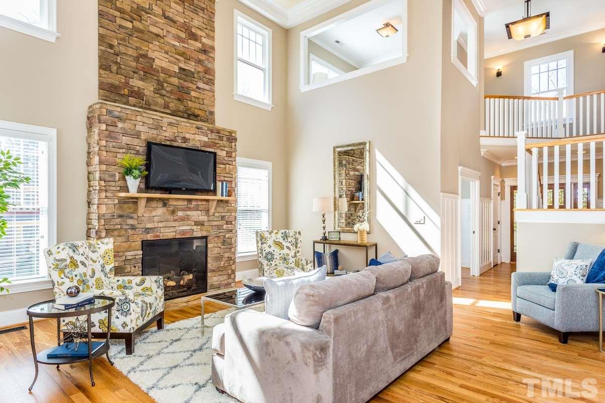 1300 Dixie Trail Raleigh, NC 27607 - Photo 4 of 24 a living room with furniture fireplace and flat screen tv