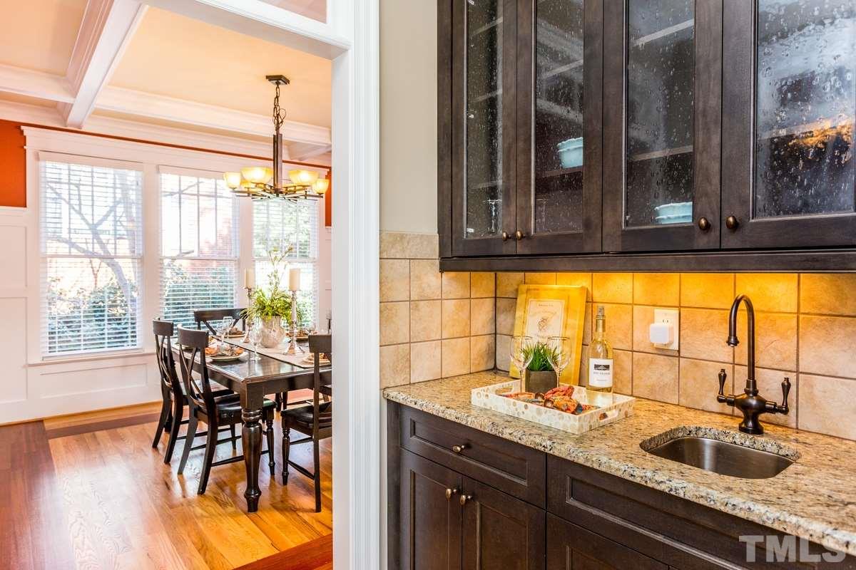 1300 Dixie Trail Raleigh, NC 27607 - Photo 6 of 24 a kitchen with a table chairs and granite counter tops
