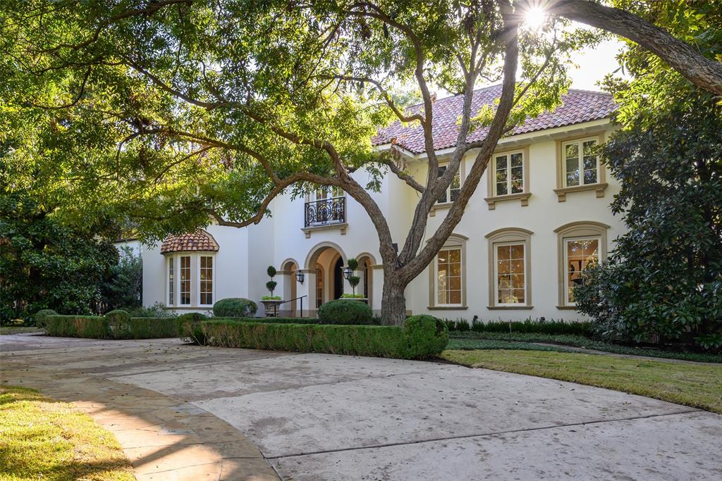 9700 Audubon Place Dallas, TX 75220 - Photo 1 of 1 a front view of a house with a yard