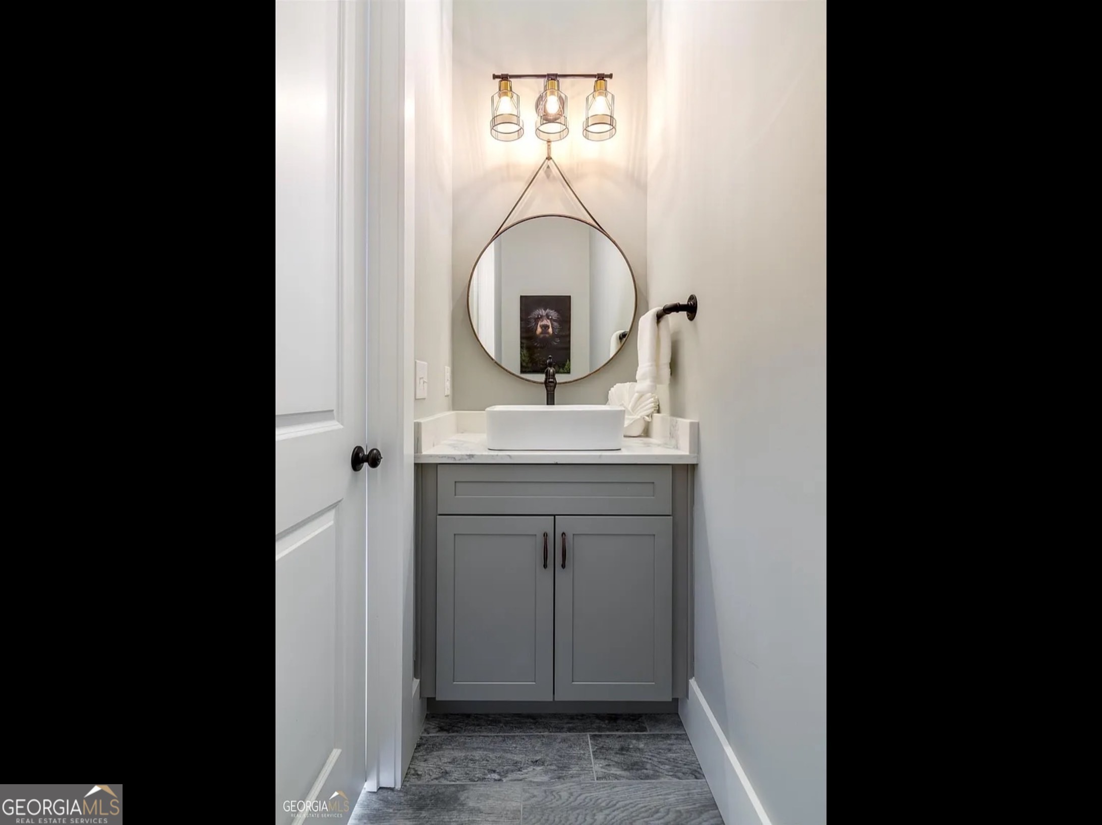 2119 Star Creek Road Morganton, GA 30560 - Photo 14 of 30 a bathroom with a sink and a mirror