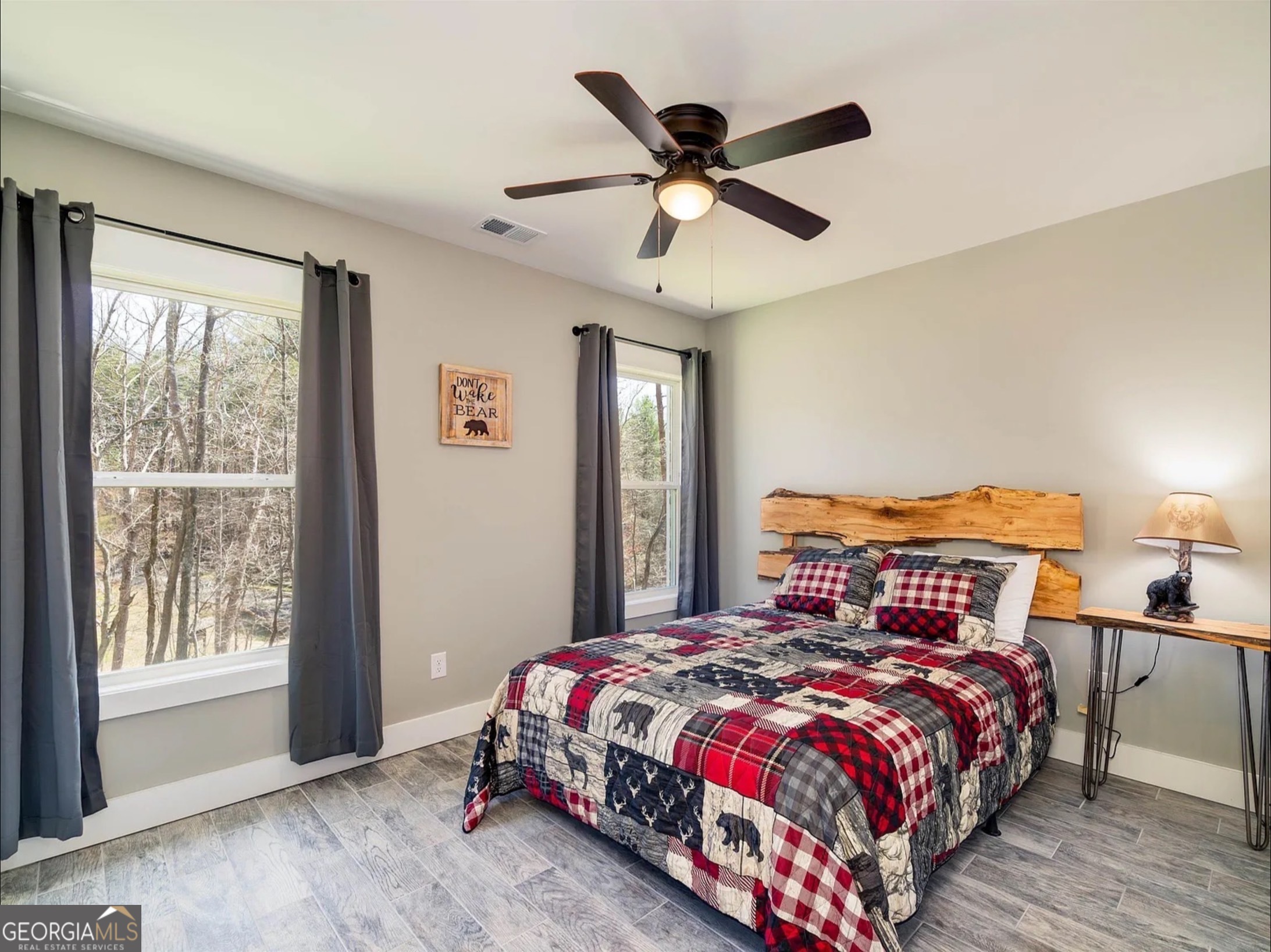 2119 Star Creek Road Morganton, GA 30560 - Photo 17 of 30 a bedroom with a large bed and a window