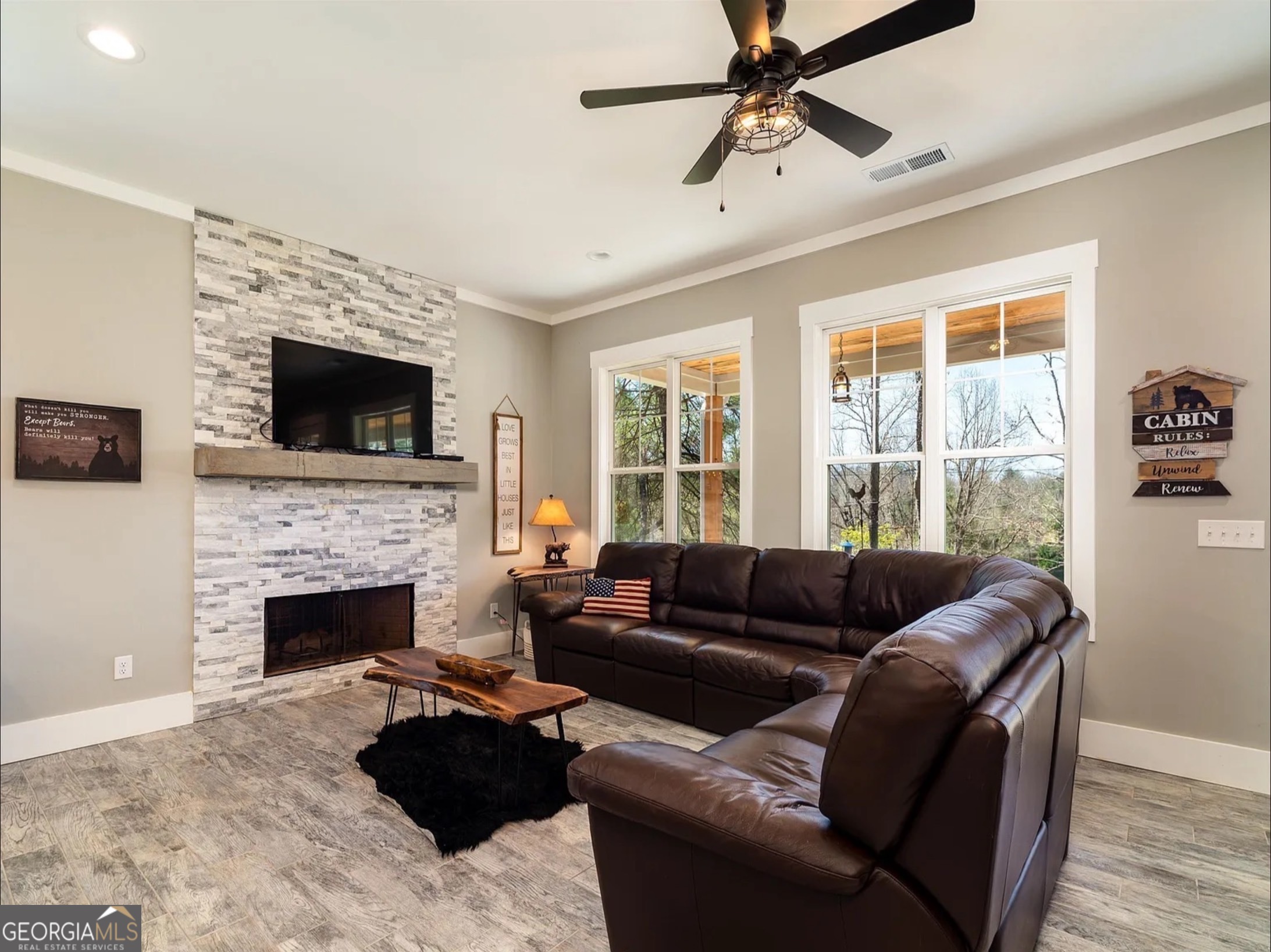 2119 Star Creek Road Morganton, GA 30560 - Photo 4 of 30 a living room with furniture a flat screen tv and a fireplace