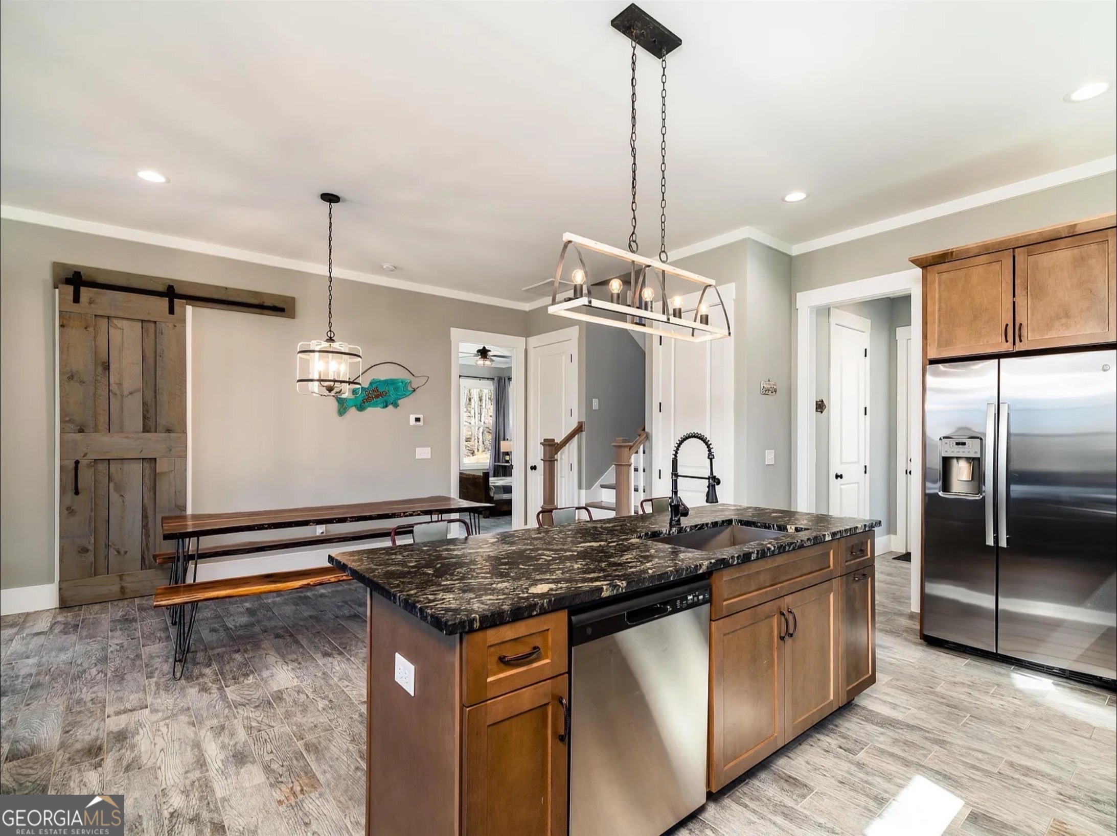 2119 Star Creek Road Morganton, GA 30560 - Photo 6 of 30 a kitchen with stainless steel appliances granite countertop a sink and a refrigerator
