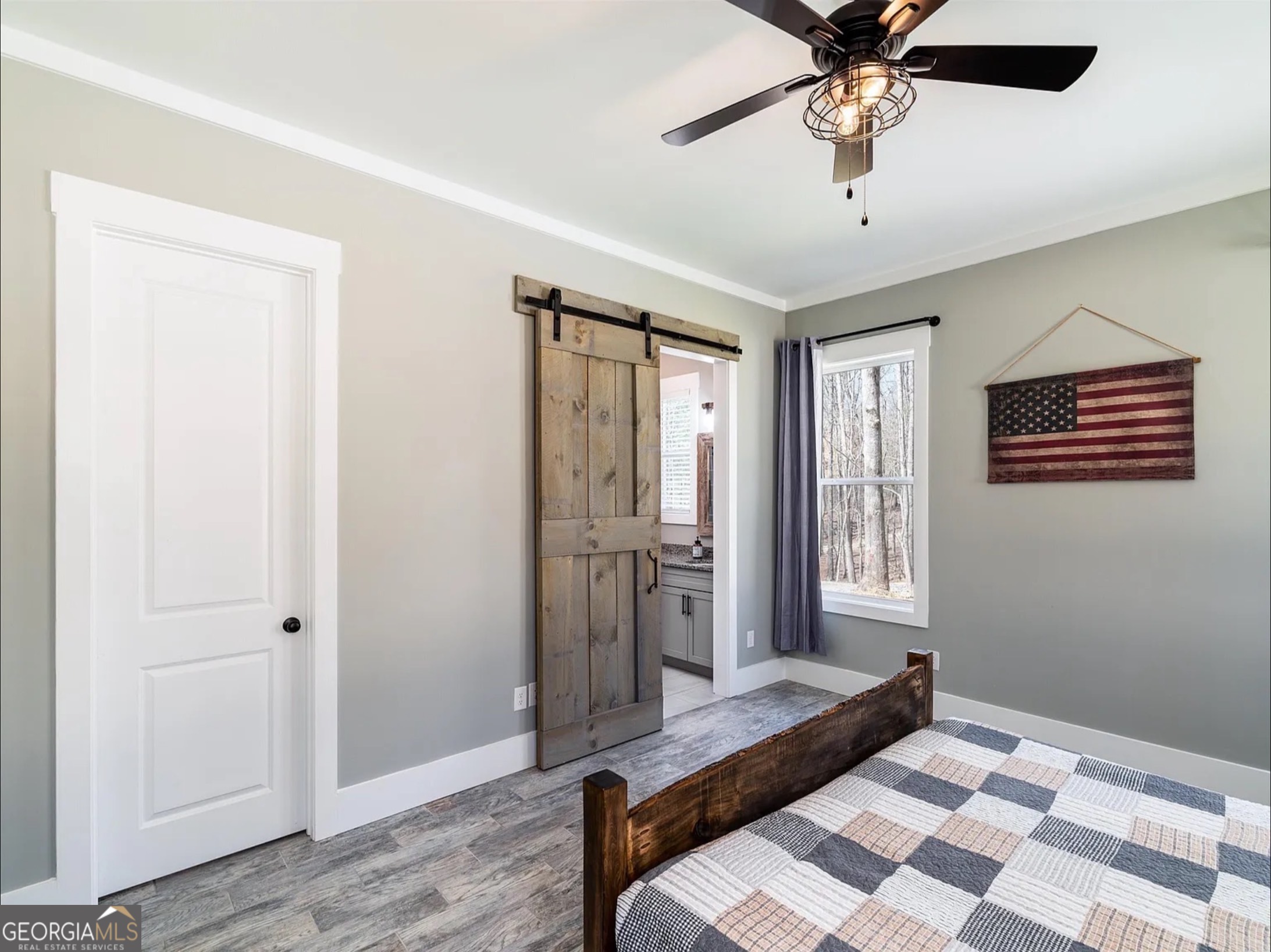 2119 Star Creek Road Morganton, GA 30560 - Photo 8 of 30 a bedroom with a bed and a chandelier