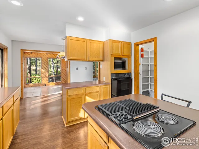 a kitchen with stainless steel appliances granite countertop a stove and a refrigerator