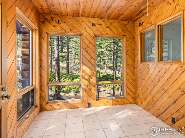 a view of an entrance to house with yard