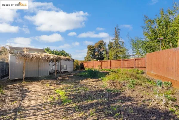a view of a backyard of the house
