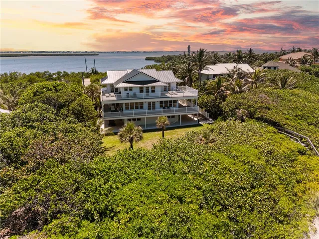 a view of a big yard with large trees